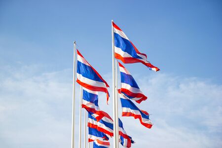 The National Flag Of Thailand with blue sky background