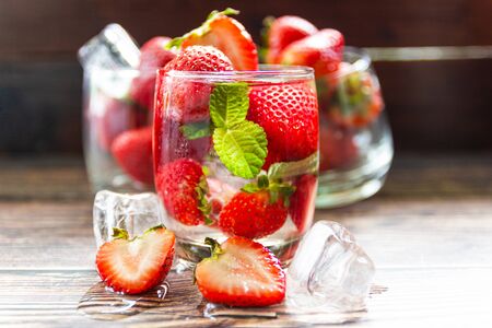 fresh Strawberry mohito cocktail with ice and mint in glass fruit to make water in the summer.の写真素材