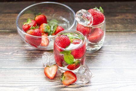 fresh Strawberry mohito cocktail with ice and mint in glass fruit to make water in the summer.の写真素材