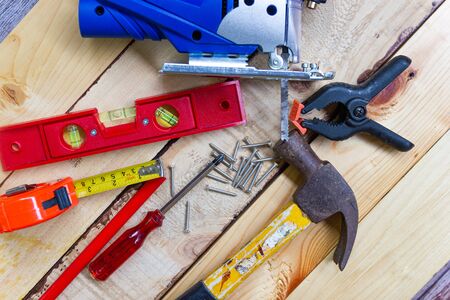 Electric drill, nut, tape measure, electric saw, ruler, screwdriver, Tools for woodworking concept Construction equipmentの写真素材
