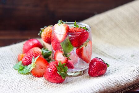 fresh Strawberry mojito cocktail with ice and mint in glass fruit to make water in the summer.の写真素材
