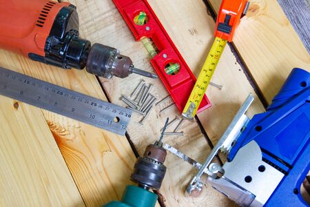 Electric drill, nut, tape measure, electric saw, ruler, screwdriver, Tools for woodworking concept...