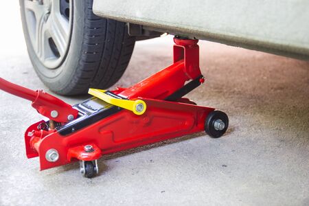 red tool jack lift car for Maintenance and service of cars at Car care maintenanceの写真素材