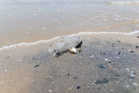 garbage and plastic bottles on a beach Asia Thailand environmental protection concept.