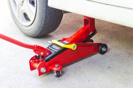 red tool jack lift car for Maintenance and service of cars at Car care maintenanceの写真素材
