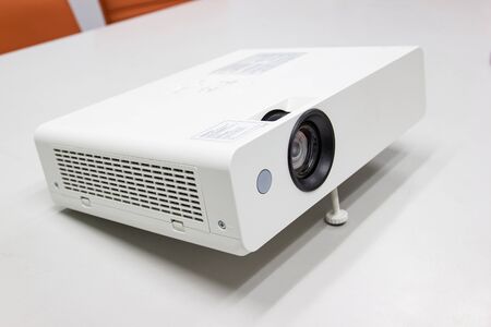 white projector for presentation for business work on table in a meeting roomの写真素材