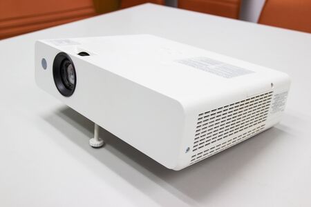 white projector for presentation for business work on table in a meeting roomの写真素材