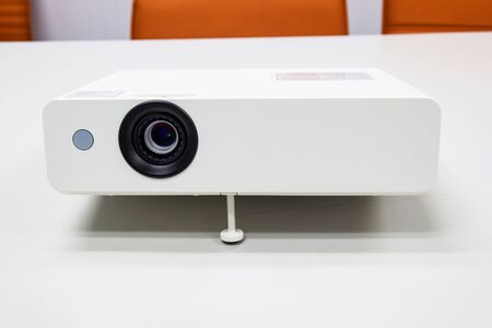white projector for presentation for business work on table in a meeting roomの写真素材
