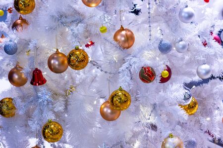 ball  gold color,  beautiful Christmas tree with decorations bokeh golden light background