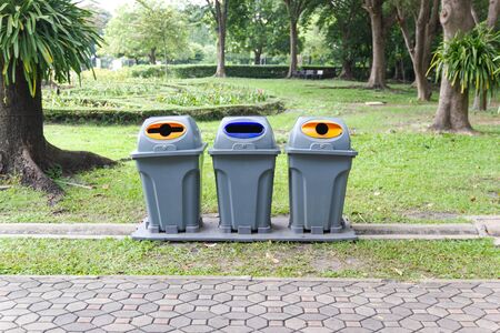 Three type recycling bin for each type of waste in the public parkの写真素材