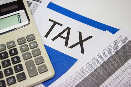 Folder Tax documents and paper files with calculator concept Annual tax paymentの写真素材