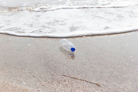 garbage and plastic bottles and dirty waste on a beach, Concept Campaign to stop using plastic...