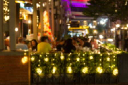 blurred image Lots of people enjoy at the bar pub fun of night festival in a restaurant and The atmosphere is party happy and relaxing.の写真素材