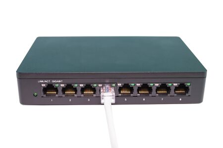 The blue network cables connect port switch on white table concept internet network connectionの写真素材