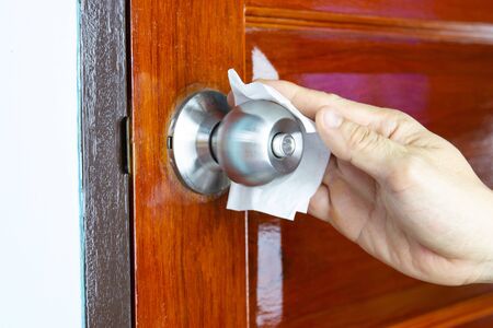 Prevention cleaning Door handles by Disinfectant solution for killing corona virus on touching surfaces, concept coronavirus COVID19の写真素材