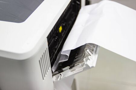 Paper A4 Stuck In Printer At Office, concept repair printerの写真素材