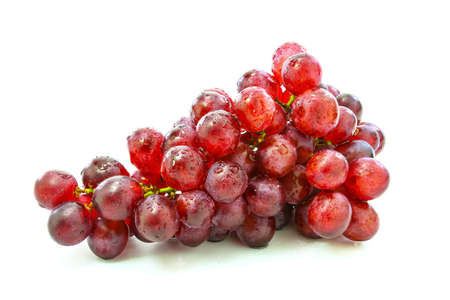 fresh grapes on Wooden tray with isolated white backgroundの写真素材