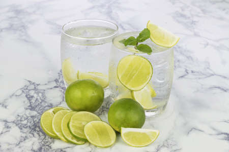 Cold Drink from Lemon cut into pieces in water glass