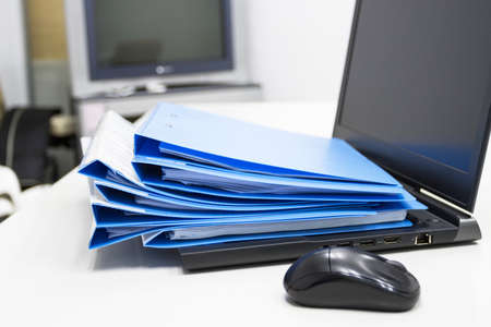 Blue Document folder with Notebook on table at officeの写真素材