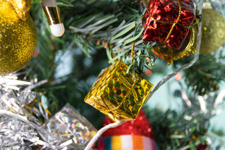 Accessories Ornaments Christmas with gift box on Christmas tree and vintage ballsの写真素材