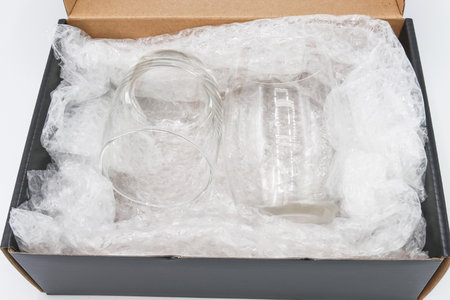 the  wrap cover water glass in box for protection product cracked or insurance During transitの写真素材