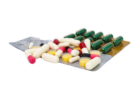 many capsules isolated white backgroundの写真素材