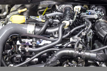 Car Rubber pipes and hoses leading from the car radiator to the engineの写真素材