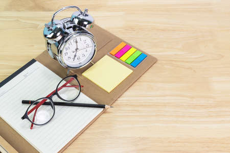 pencil, folder file, glasses on white wood table concept Office equipmentの写真素材