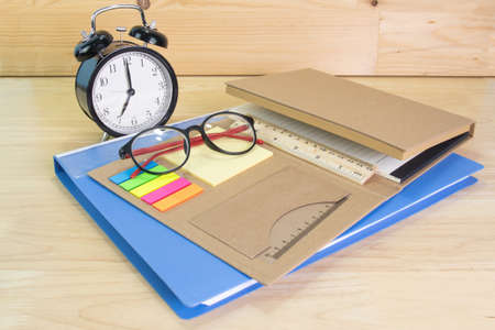 pencil, folder file, glasses on white wood table concept Office equipmentの写真素材