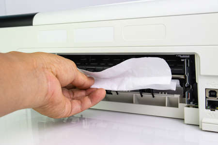 Technicians Removing Paper Stuck, Paper Jam In Printer At Office