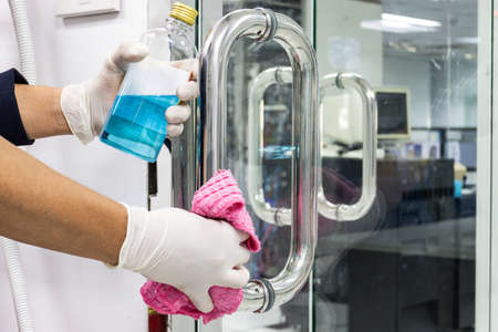 Prevention cleaning Door handles by Disinfectant solutionの写真素材
