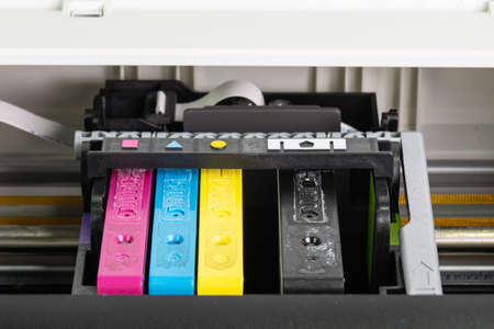 An ink cartridge or inkjet cartridge is a component of an inkjet printer that contains the ink four colorの写真素材