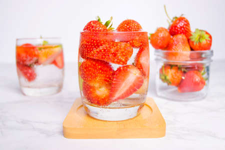 fresh Strawberry mojito cocktail with ice and mint in glass fruit to make water in the summer.の写真素材