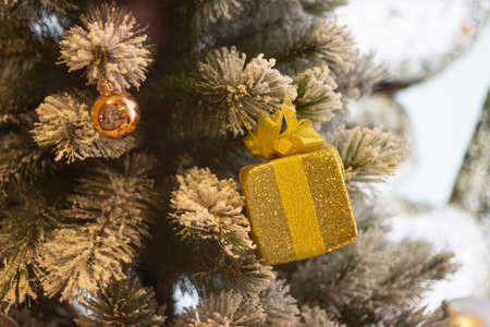 Christmas decorative with the ball and gift box on Christmas tree