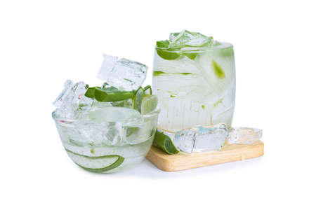Aloe vera slices in glass for a drink with isolated white backgroundの写真素材