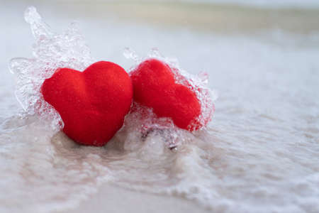 Red heart on a sandy beach concept Valentine day copy scapeの写真素材