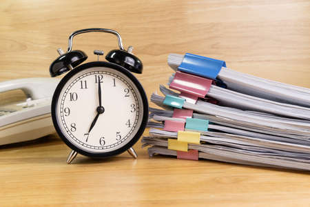 7 AM Clock on work desk in the office Time of business working concepts selective clockの写真素材