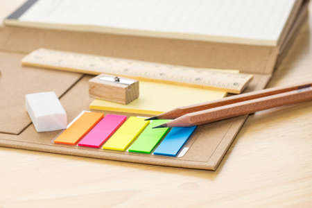 pencil on notebook concept education school equipment on wood table