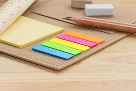 selective focus multicolored square colorful sticky notes on book note concept equipment office and...