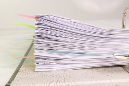 white paper stack in folder file for a business contract, income, expensesの写真素材