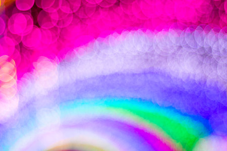 A captivating display of blurred lights in a rainbow palette, perfect for creating a festive or...