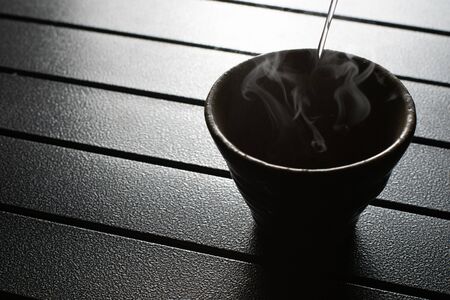 tea cup on the table with smokeの写真素材