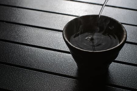 tea cup on the table with smokeの写真素材