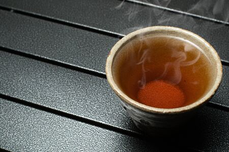 tea cup on the table with smokeの写真素材