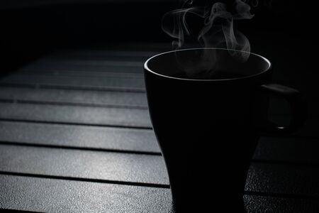 tea cup on the table with smokeの写真素材