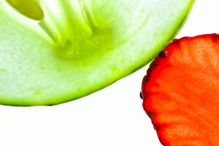 Cucumber and strawberry isolated on whiteの写真素材