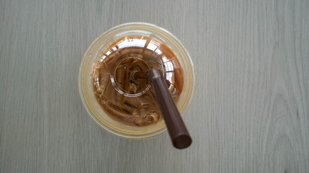 Iced coffee on wood backgroundの写真素材