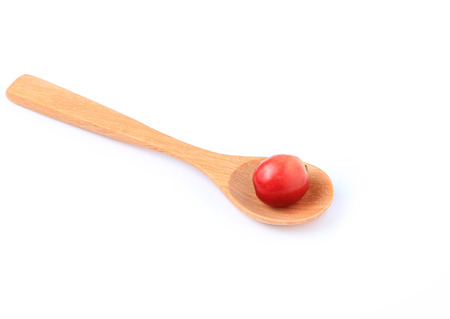 Fresh coffee on a wooden spoon isolated on a white background.の写真素材