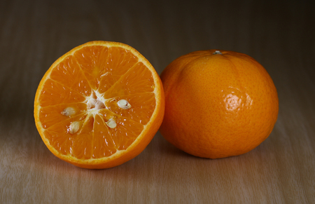 Orange on old  wooden floorの写真素材