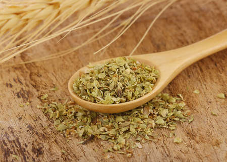 Oregano on wooden spoonの写真素材